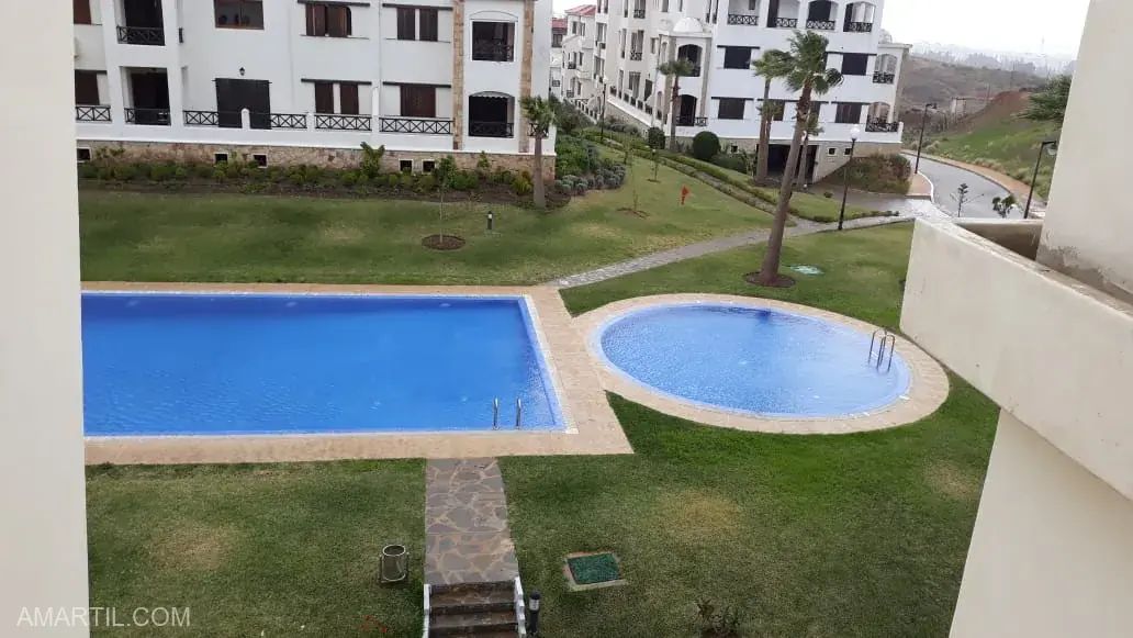 appartement parfait à louer à cabo negro 2 chambre salon balcon piscine à Reside